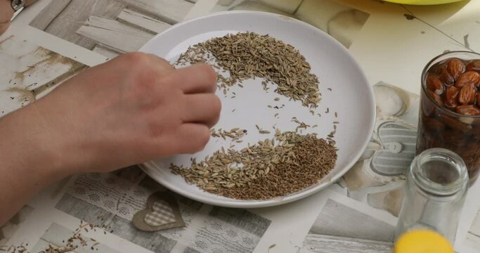 a hand sieving and cleaning seeds, remove impurity of anise and fennel seeds