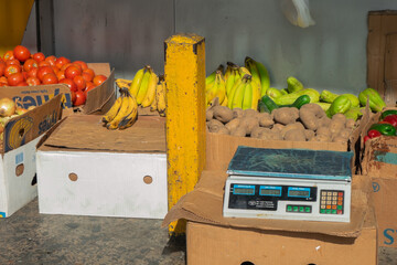 variety of fresh fruits and vegetables, banana, paprika, chayote, potato, onion, tomato, ready to weigh and take away