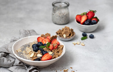 Bowl of fresh homemade oatmeal porridge with berries. Healthy food for Breakfast.