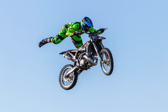 2020 Italy, Rome, KTM practice warm-up before a live-action show. Extreme sports, professional stunt biker performing a very dangerous trick in mid-air. Acrobatic riding, life or death experience.