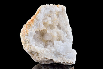 Amazing pure Quartz Crystal geode with crystalline closeup macro isolated on black background....