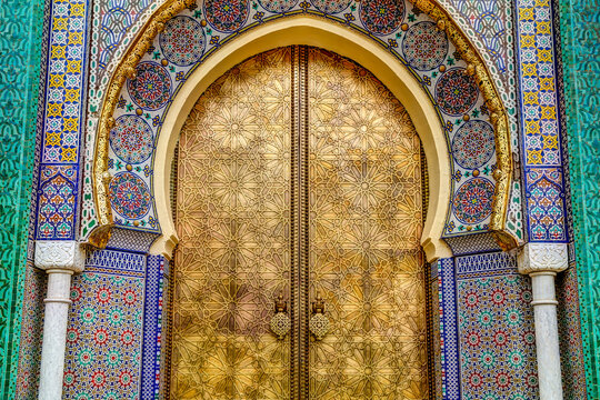 Intricate tile patterns, metal work and plaster carvings adorning  building exteriors in Fez Morocco