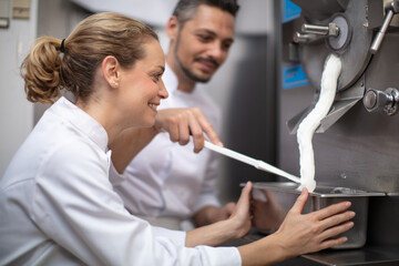 chef and woman assistant filling ice cream
