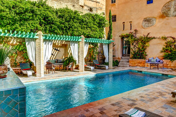 Pool and deck area of Riad Laaroussa in Fes Morocco.