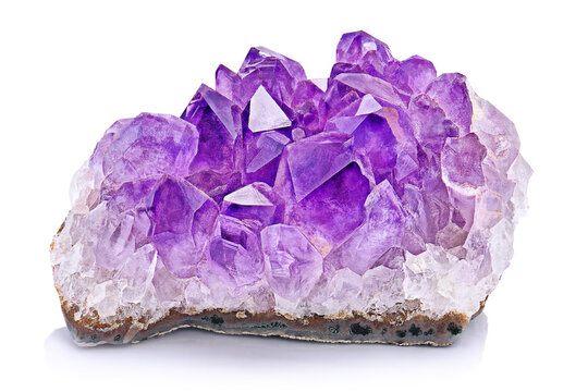 Amazing rare shape sparkly Violet Crystal Stone macro mineral surface. Purple rough Amethyst quartz Crystals geode on white background. Amethyst looks like a cave made of stone.