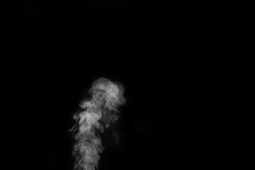 Curly white steam rising up isolated on a black background. Fog backdrop for your photos.