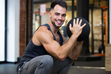Fototapeta na wymiar fitness young man using medicine ball