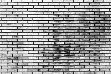 Obraz premium Texture of a brick wall with cracks and scratches which can be used as a background