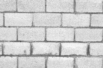 Texture of a brick wall with cracks and scratches which can be used as a background