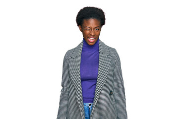 Young african american girl wearing casual clothes winking looking at the camera with sexy...