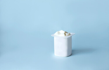 Yogurt pot mockup on light blue background