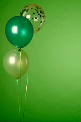 Concept of St. Patrick. Green balloons on green background, copy space for text