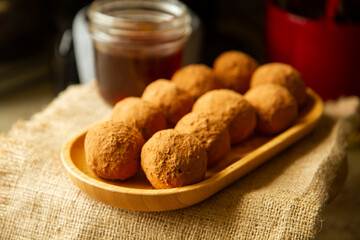 Healthy homemade paleo, hight protein chocolate energy balls with nuts anddates. Raw vegetarian sweets. Sugar free, gluten free.Tasty chocolates, confectionery concept