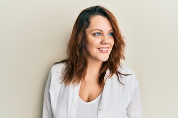 Obraz premium Young caucasian woman wearing casual clothes looking to side, relax profile pose with natural face and confident smile.