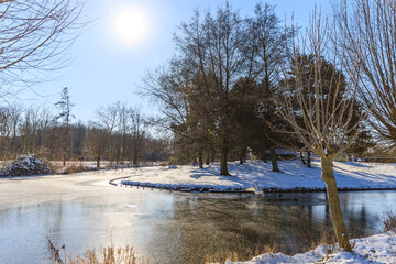 frozen lake in park in Hoogvliet, dutch winter in The Netherlands, February