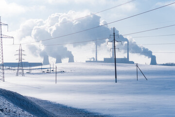 Thermal power plant pipes in winter. Industrial landscape.
