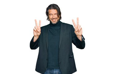 Fototapeta premium Middle age handsome man wearing business clothes smiling looking to the camera showing fingers doing victory sign. number two.