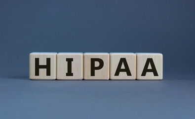 HIPAA, Health Insurance Portability and Accountability Act of 1996 symbol. Words 'HIPAA, Health Insurance Portability and Accountability Act', beautiful grey background. Business concept. Copy space.
