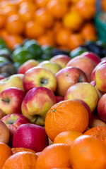 Farmers market, red and yellow apples, oranges, fresh and colorful.