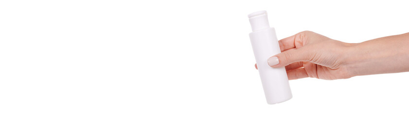 The hand with the white bottle with the disinfectant, isolated on a white background.