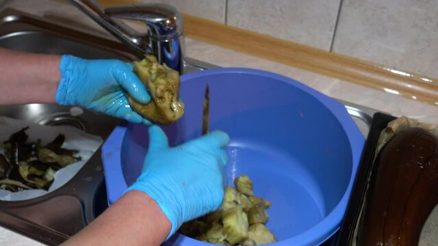 Cutting roasted eggplant into small pieces - (4K)