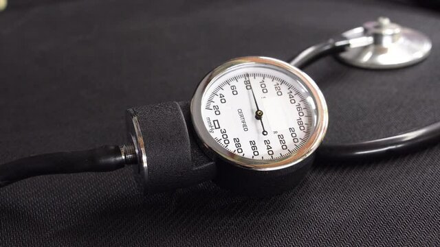 Closeup of Blood Pressure Measuring. measuring  blood pressure using a mechanical tonometer  at home