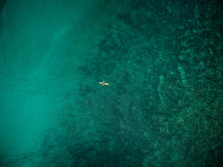 Aerial overhead view of fishing kayks on the coastline of the Mediterranean Sea, Marbella, Malaga, Spain.
