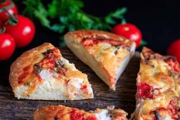 pizza flatbread on thick dough fast food cheese, tomato sauce, tomato and other ingredients portion on the table healthy meal snack outdoor top view copy space for text food background rustic image
