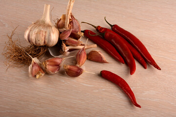 hot peppers and garlic on a white background.Organic garlic and hot pepper