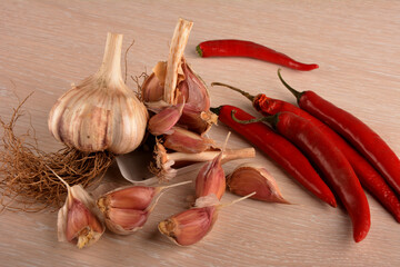 hot peppers and garlic on a white background.Organic garlic and hot pepper