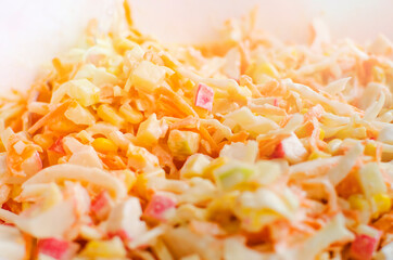 Chopped vegetables - cabbage, carrots, corn. Vegetable salad close-up.