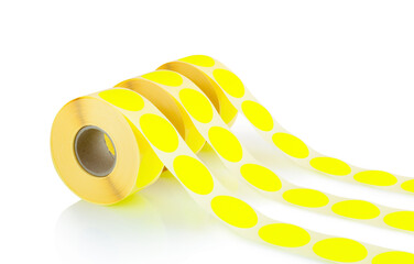 Yellow label rolls isolated on white background with shadow reflection. Reels of colored labels for...