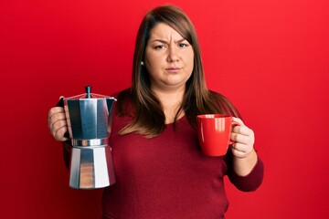 Beautiful brunette plus size woman drinking italian coffee skeptic and nervous, frowning upset because of problem. negative person.