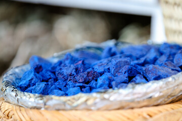 Macro of raw indigo and other pigments in the souk of Marrakech Morocco