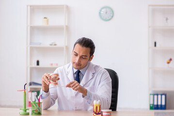 Young male doctor stomatologist working in the clinic