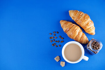 Cups of coffee on a blue background