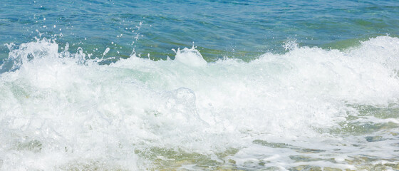 Sea wave and pebble. Summer vacation concept. Sea wave with foam. Travel concept