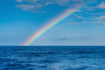 Colorful rainbow over the open atlantic ocean