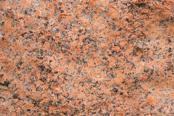 Texture. Granite red and black wall.
