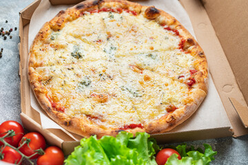 cheesy pizza several types of cheese fast food and other ingredients portion on the table healthy meal snack outdoor top view copy space for text food background rustic image