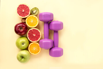 Sports and fruit set with female dumbbells Healthy lifestyle concept