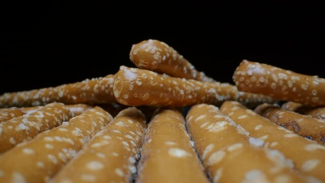 PRETZEL RODS UP CLOSE.  4K, MACRO SLIDER SHOT.  NO PEOPLE.
