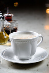 Alcoholic coffee cocktail with coffee liqueur and milk, alcoholic cocktail in a cappuccino coffee mug. Coffee with Irish whiskey and whipped cream