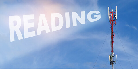 Against the background of a blue sky with clouds it is written - READING