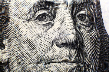 Close up portrait of Benjamin Franklin on a 100 dollar bill