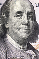 Close up portrait of Benjamin Franklin on a 100 dollar bill