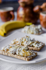 Sandwich with cottage cheese, honey and banana on a diet bread