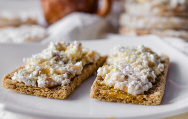 Sandwich with cottage cheese, honey and banana on a diet bread