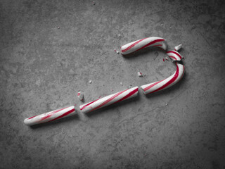Moody Top-Down Shot of a Red and White Candy Cane that has Been Shattered into Multiple Pieces