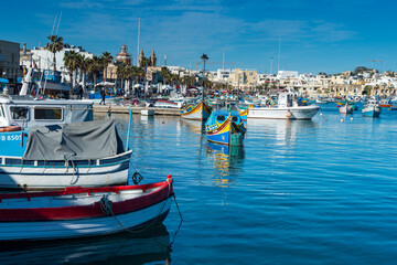 Fototapeta na wymiar Marsaxlokk is a traditional fishing village located southeast of Malta